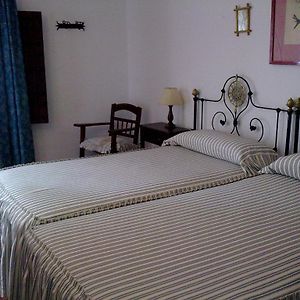 Habitación Comunicada con Cama Queen